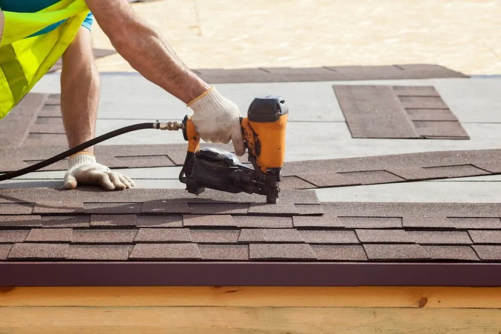 nailing-in-shingles-on-roof