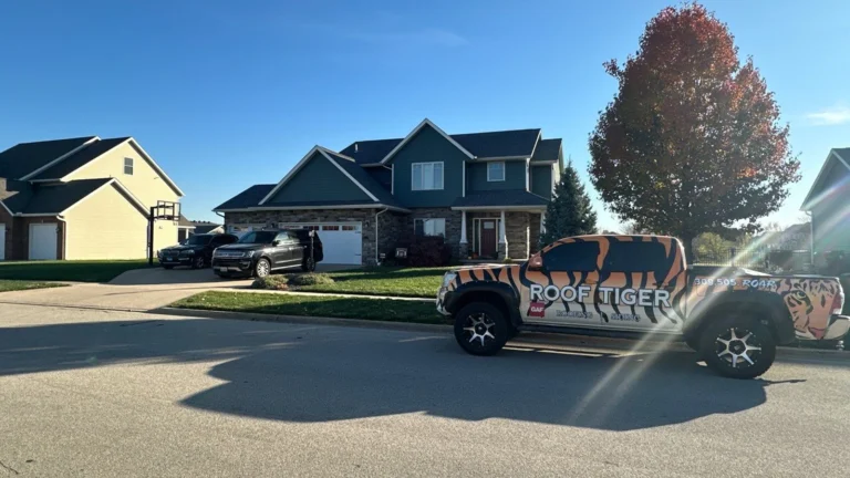 A residential roofing project completed by ROOF TIGER, showing a two-story home and a branded tiger-stripe truck.