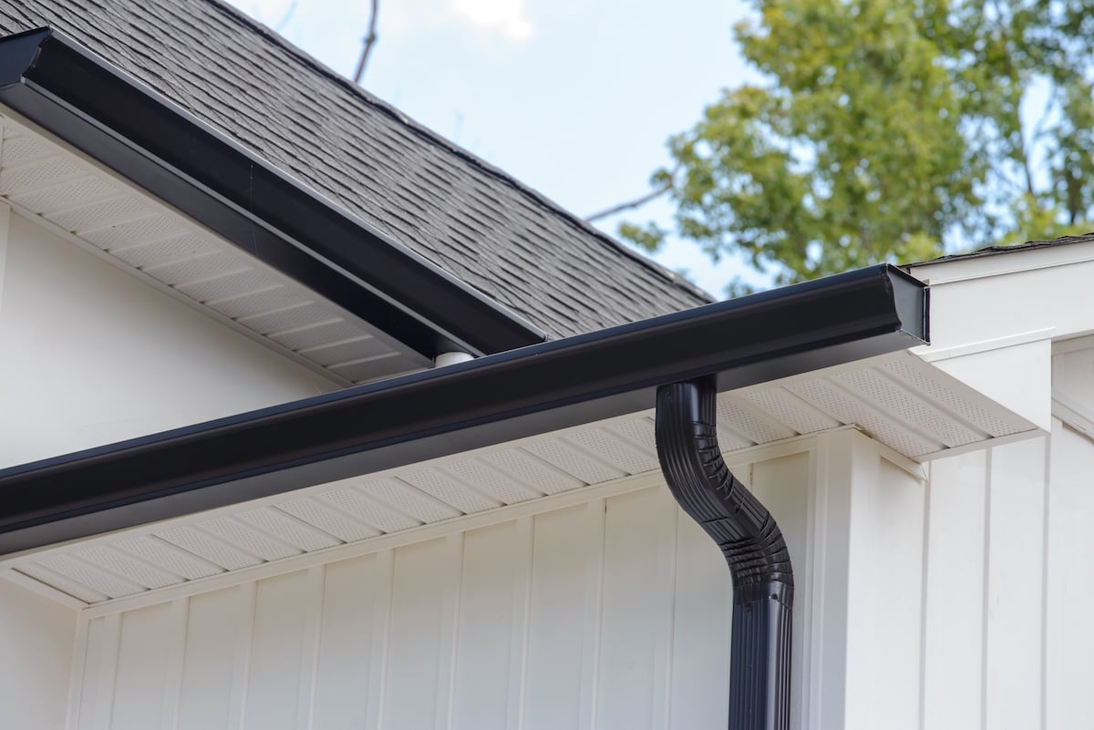 rain gutter of roof with downpipe metal corner wall rooftop