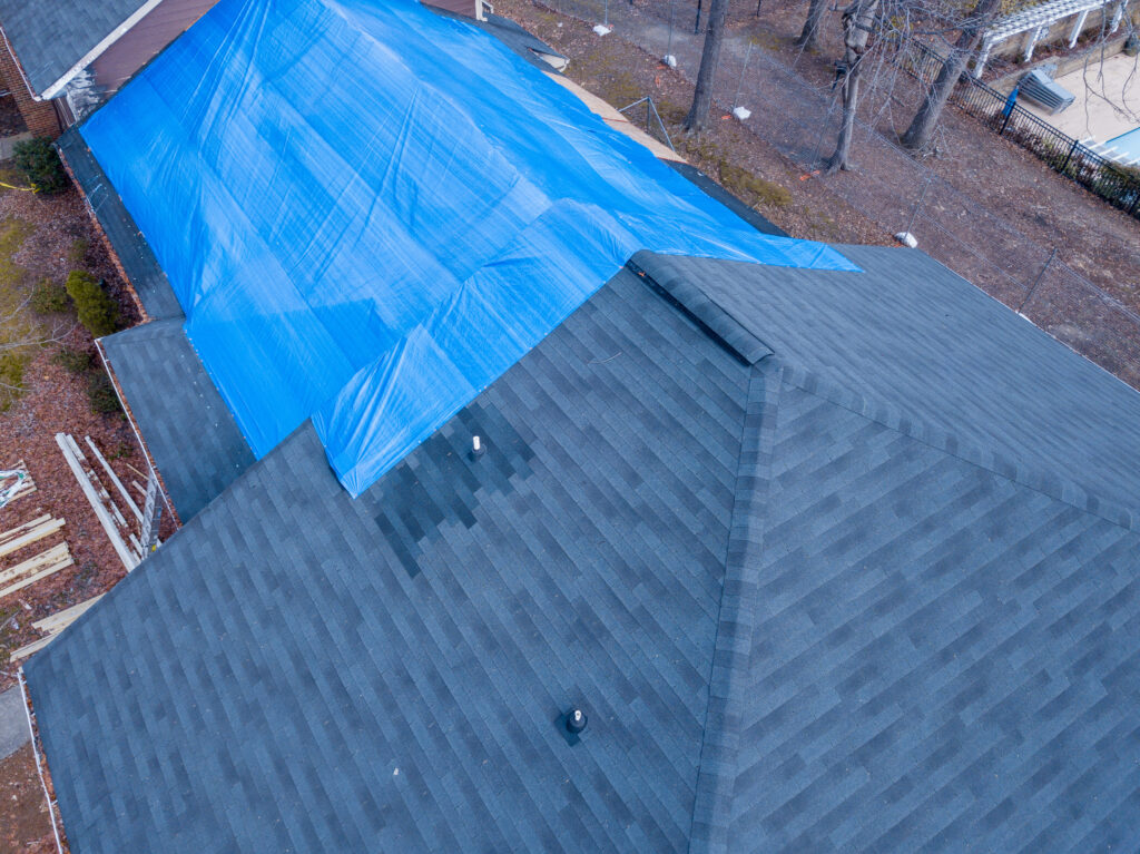 how to tarp a roof Fire damaged apartment building