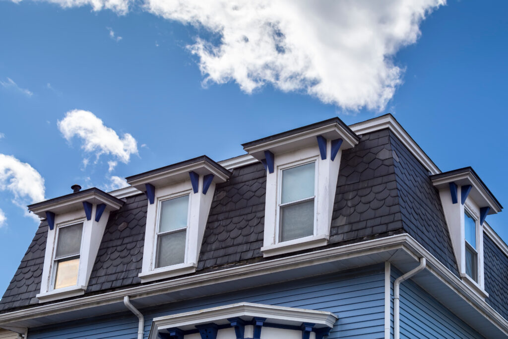 Mansard roof and shed dormers of a single family house