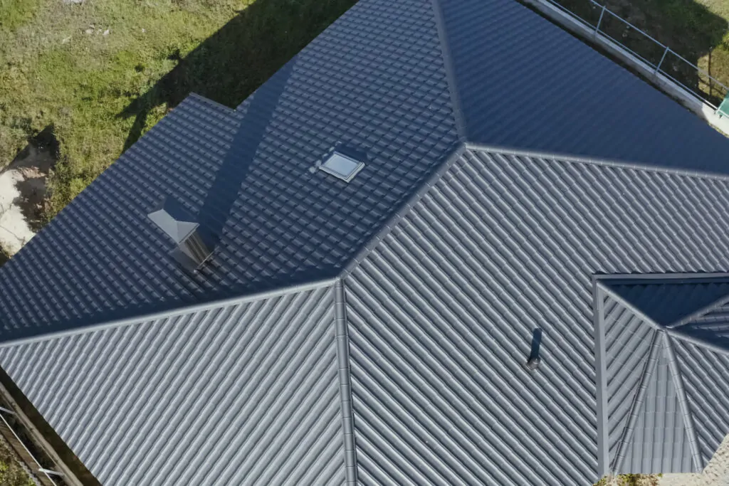 types of metal roofing Modern roof made of metal. Corrugated metal roof and metal roofing.