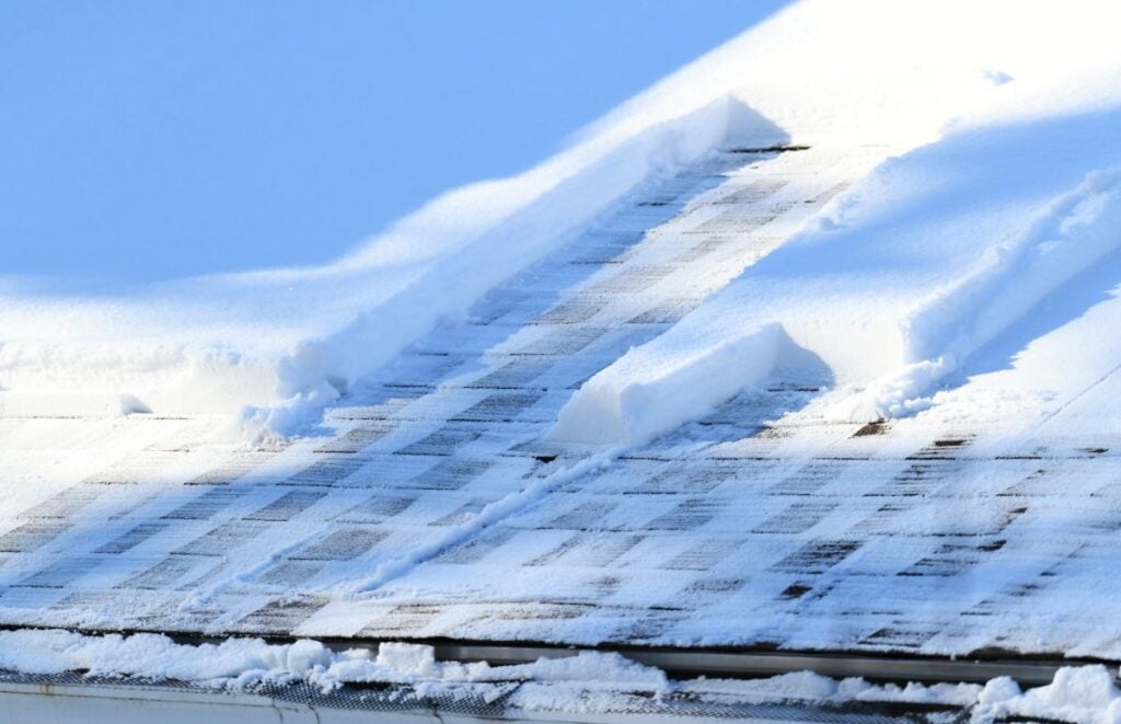shingle roof covered in snow