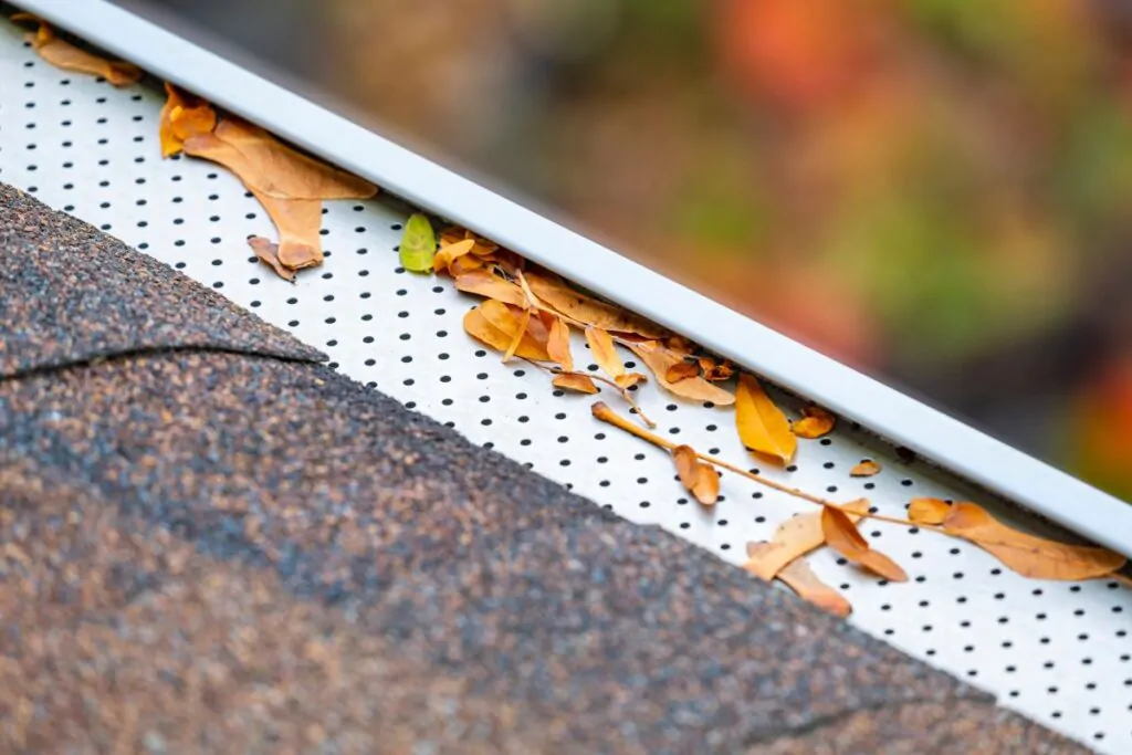 Closeup of Eaves Trough with Leaf or Gutter Filter. How Much Does Gutter Cleaning Cost?