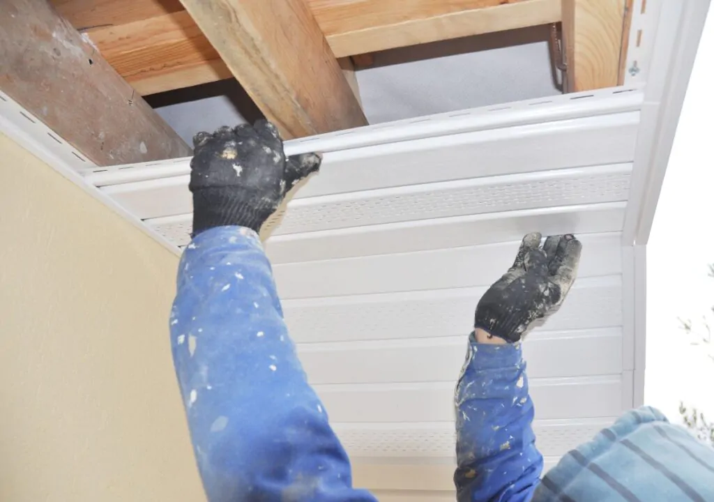 Contractor installing soffit and fascia boards. Soffit Repair: Warning Signs Every Homeowner Should Know