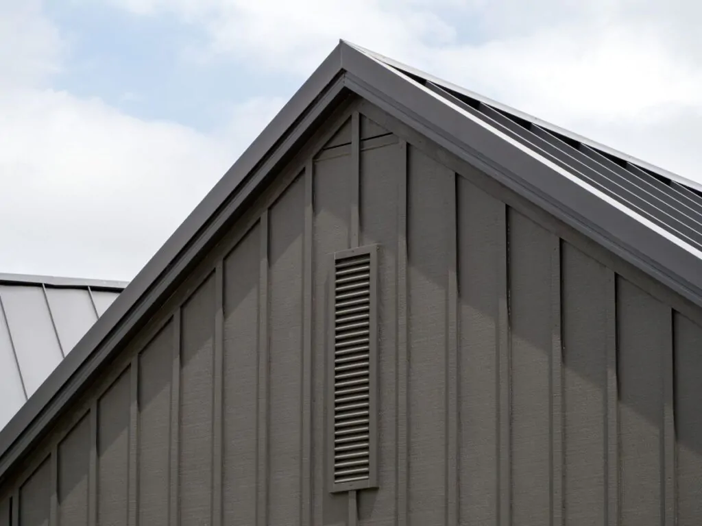 Modern gable roof with vertical cladding and ventilation grille