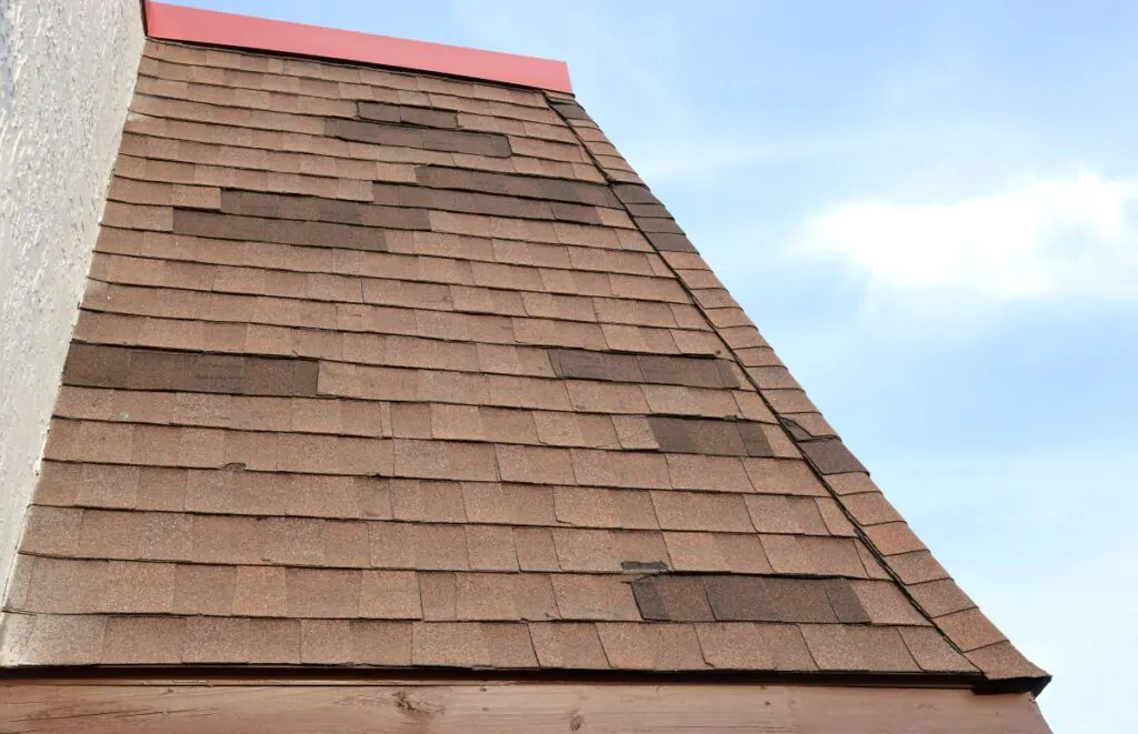 Patched and Mismatched Mansard Shingle Roof