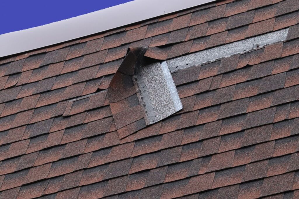 Damaged Brown Roof Shingle - Wind Damage